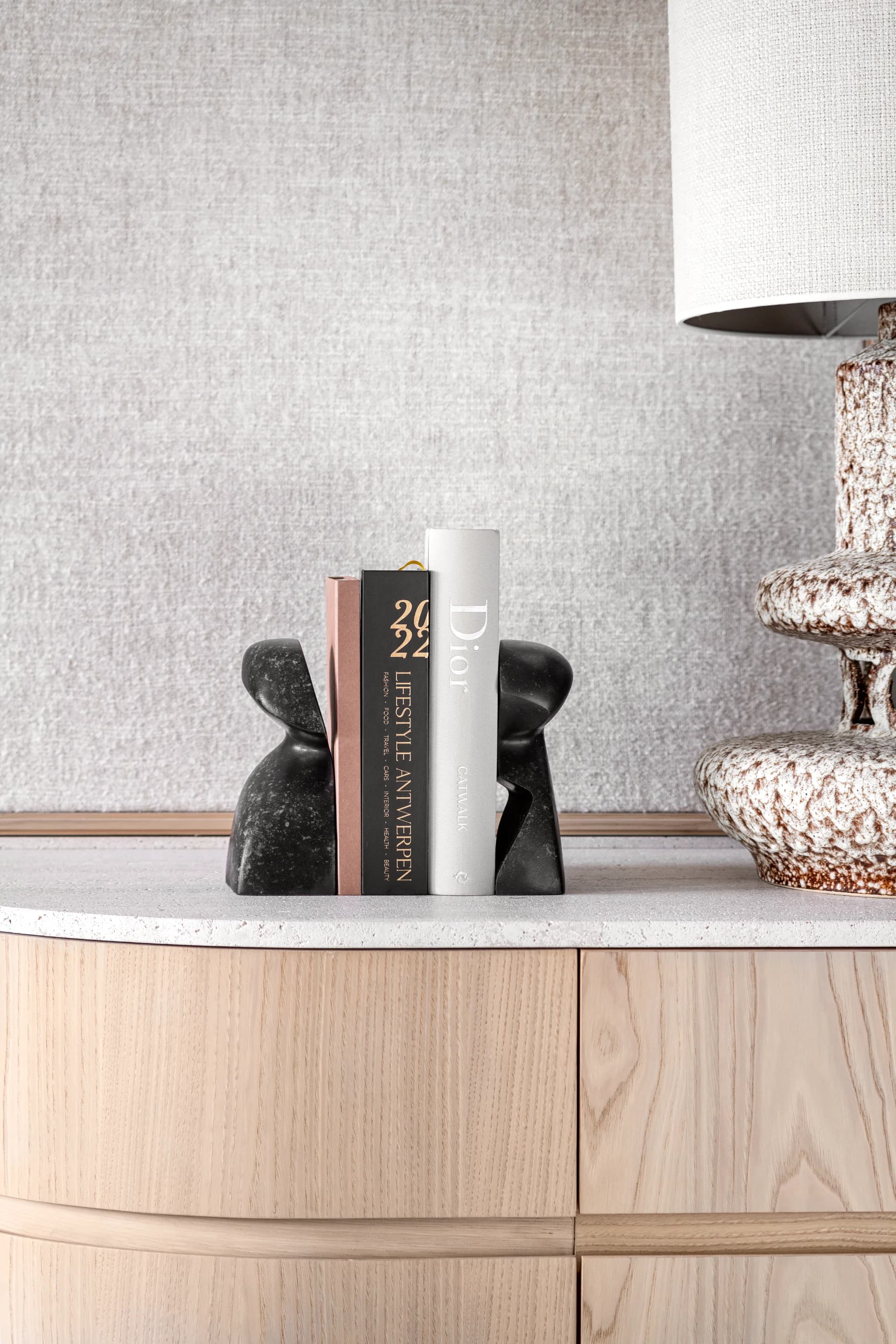 Gardeco luxury bookends in black and grey marble, in a luxury living room