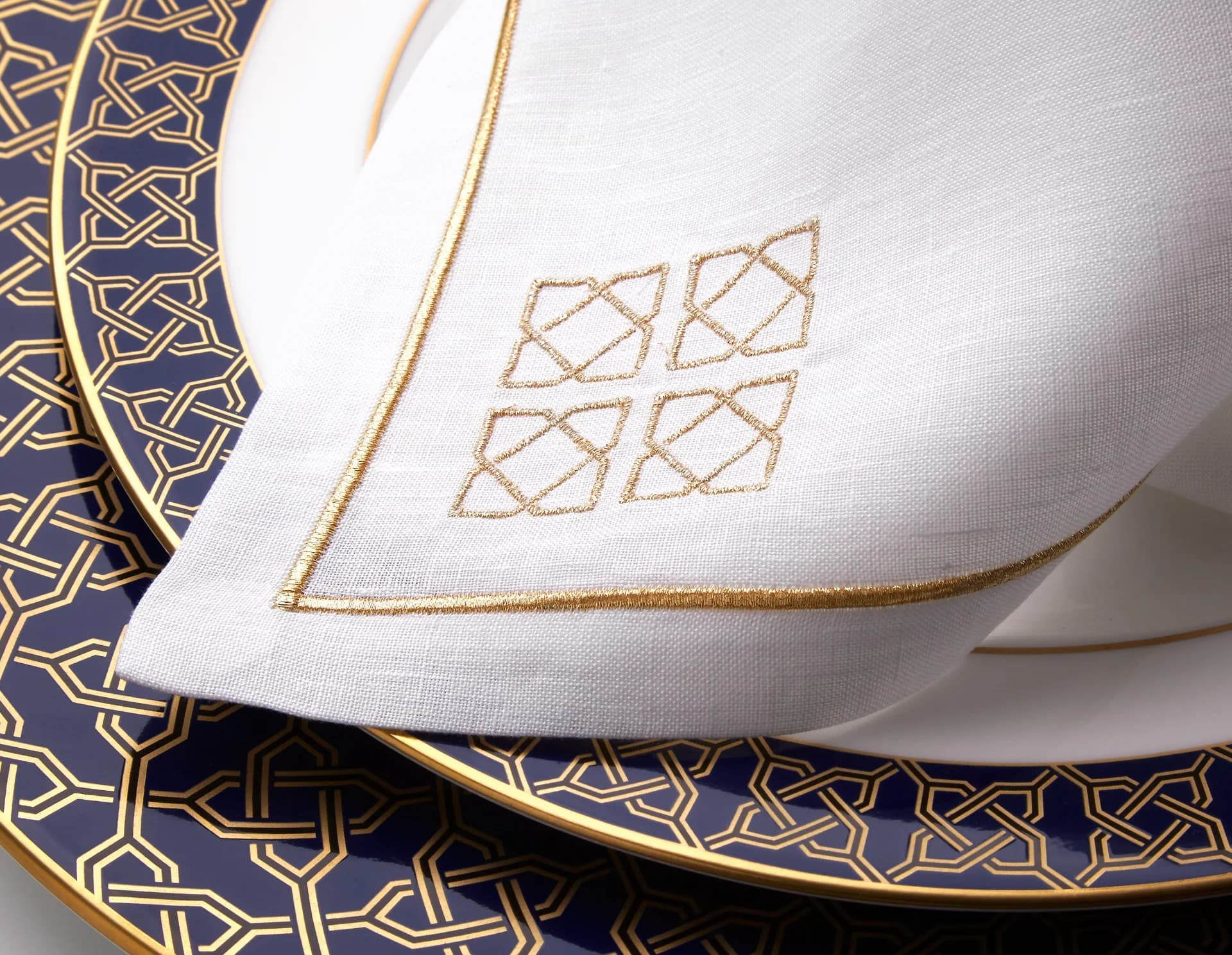 Luxurious table linens and napkins in a dining setting.