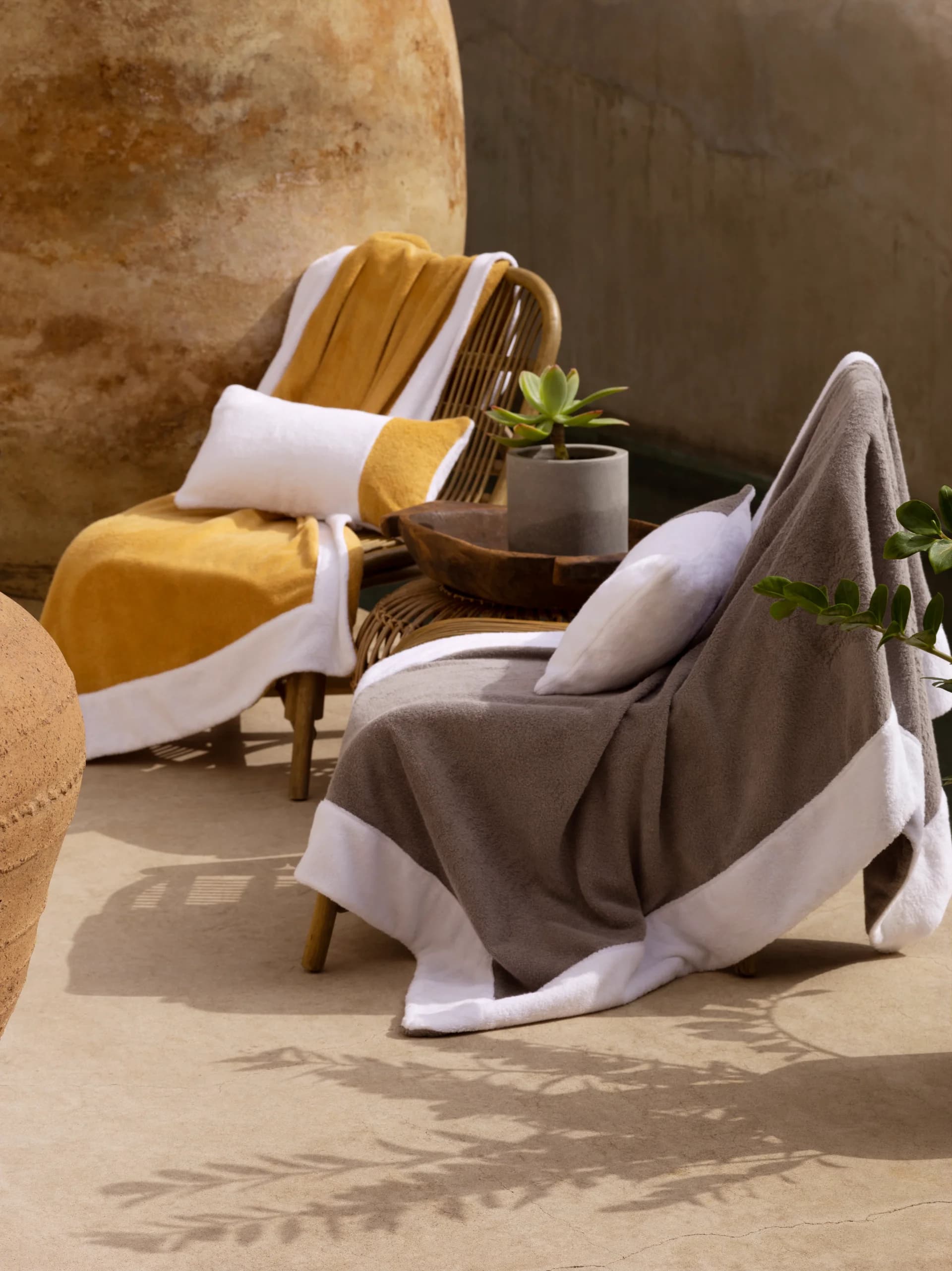 Plush, neatly folded towels for a spa or bathroom.