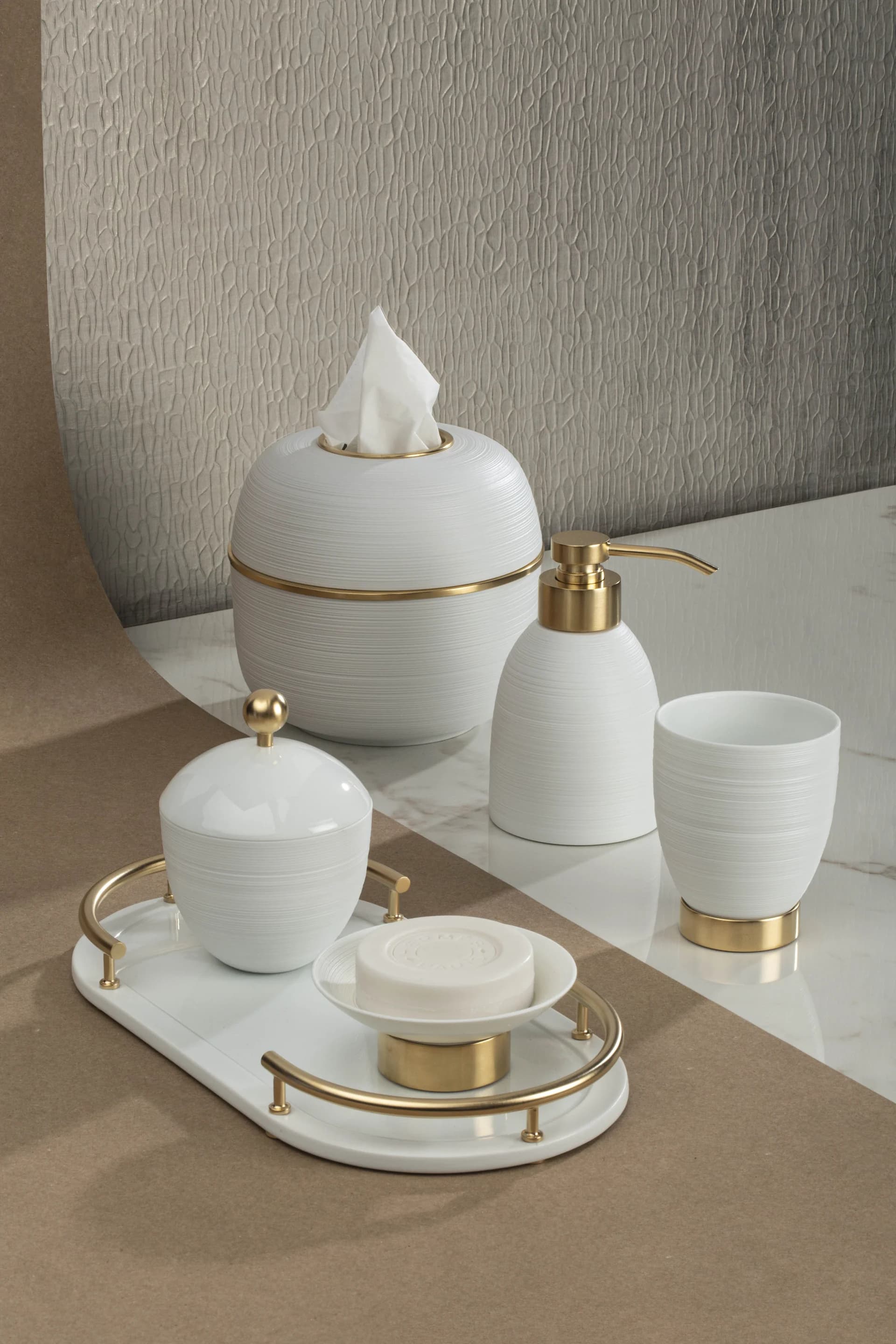 Elegant bathroom accessories including soap dispensers and trays.